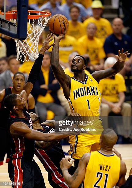 Lance Stephenson of the Indiana Pacers goes to the basket as Chris Bosh of the Miami Heat defends during Game Two of the Eastern Conference Finals of...