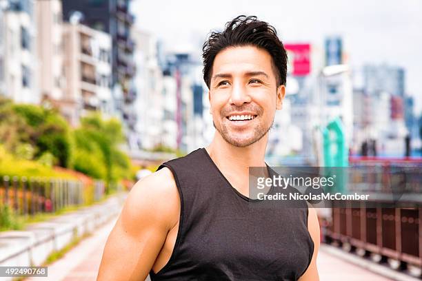healthy mature japanese man portrait exercising in tokyo - adult male vest exercise stock pictures, royalty-free photos & images