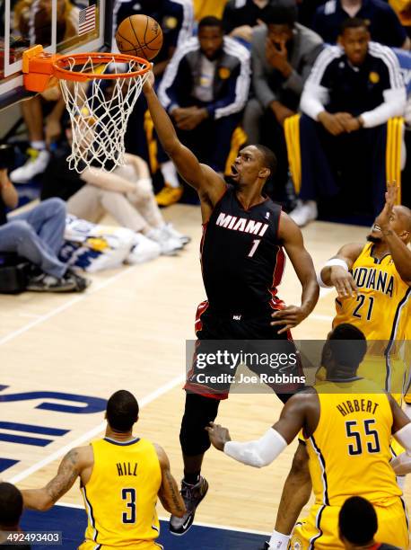 Chris Bosh of the Miami Heat goes to the basket as David West of the Indiana Pacers defends during Game Two of the Eastern Conference Finals of the...