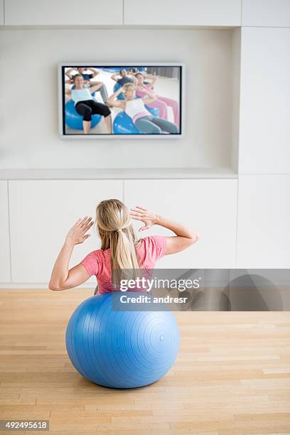 woman exercising at home - gym excercise ball stock pictures, royalty-free photos & images