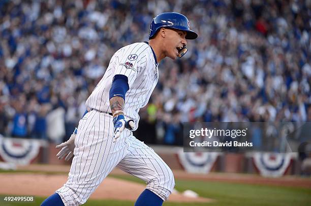 Javier Baez of the Chicago Cubs runs the bases after hitting a three-run home run in the second inning against the St. Louis Cardinals during game...