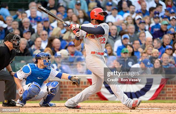 Jason Heyward of the St. Louis Cardinals singles in the top of the sixth inning Game 4 of the NLDS against the Chicago Cubs at Wrigley Field on...