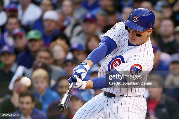 Anthony Rizzo of the Chicago Cubs hits a solo home run in the sixth inning against the St. Louis Cardinals during game four of the National League...