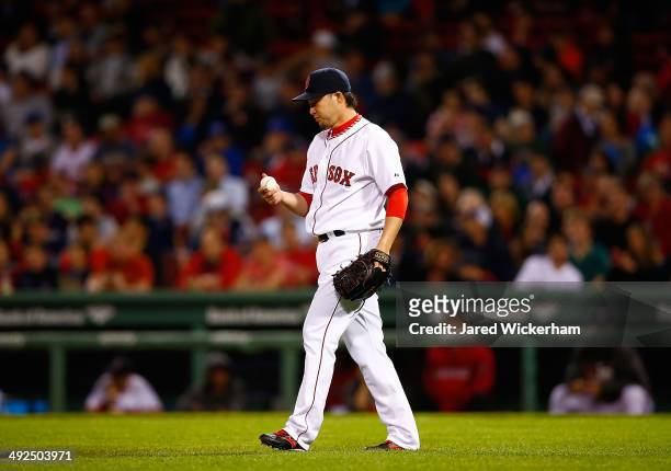Junichi Tazawa of the Boston Red Sox pitches against the Toronto Blue Jays in the ninth inning during the game at Fenway Park on May 20, 2014 in...
