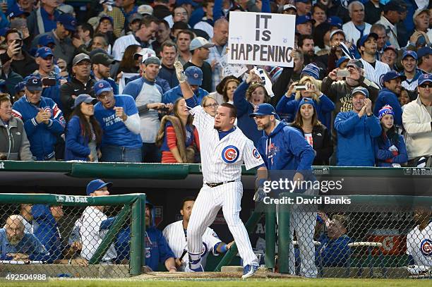 Kyle Schwarber of the Chicago Cubs celebrates at the dugout after hitting a solo home run in the seventh inning against the St. Louis Cardinals...