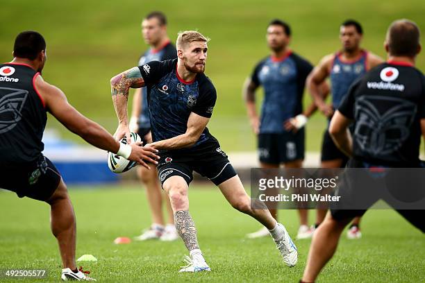 Sam Tomkins of the Warriors passes during a New Zealand Warriors NRL training session at Mt Smart Stadium on May 21, 2014 in Auckland, New Zealand.