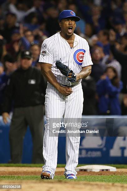 Pedro Strop of the Chicago Cubs reacts after recording the final out in the eighth inning against the St. Louis Cardinals during game four of the...