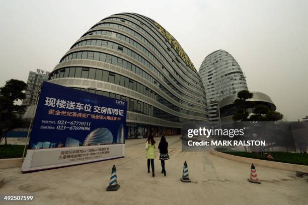 China-culture-architecture-trade-offbeat,FEATURE by Carol Huang This photo taken on on February 21, 2014 shows a new building that has a striking...