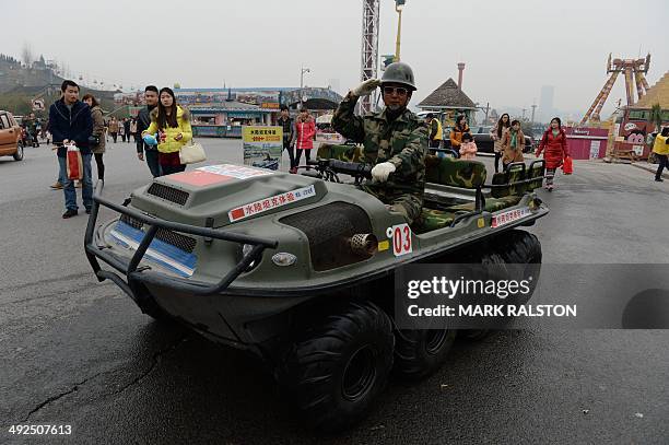 China-culture-architecture-trade-offbeat,FEATURE by Carol Huang This photo taken on on February 21, 2014 shows a military ride at a theme park in...