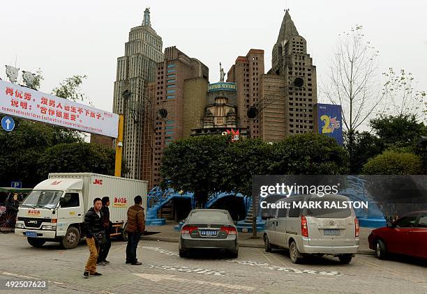 China-culture-architecture-trade-offbeat,FEATURE by Carol Huang This photo taken on on February 21, 2014 shows tourists walking past a copy of the...