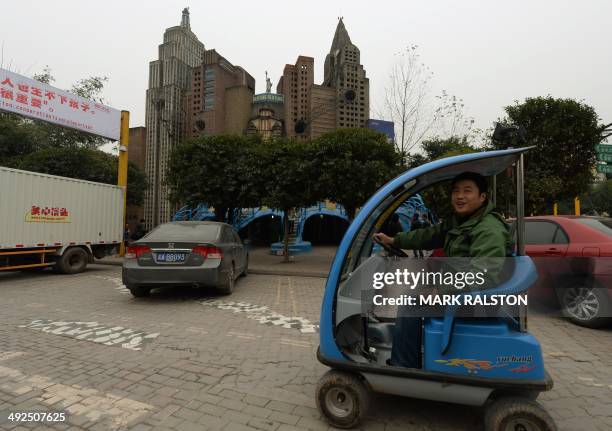 China-culture-architecture-trade-offbeat,FEATURE by Carol Huang This photo taken on on February 21, 2014 shows a tourist driving past a copy of the...