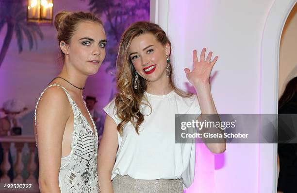 Amber Heard, Cara Delevingne attend the Porsche At De Grisogono 'Fatale In Cannes' Party - during the 67th Cannes Film Festival on May 20, 2014 in...