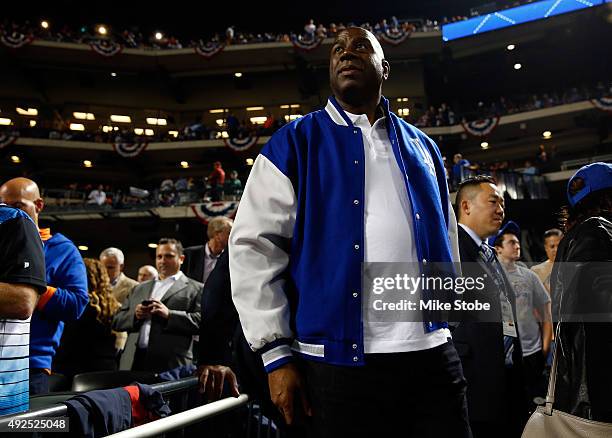 Earvin "Magic" Johnson attends game four of the National League Division Series between the Los Angeles Dodgers and the New York Mets at Citi Field...