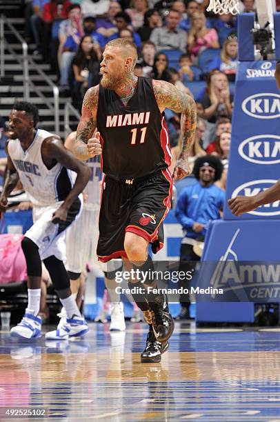 Chris Andersen of the Miami Heat drives to the basket against the Orlando Magic during a preseason game on October 13, 2015 at Amway Center in...