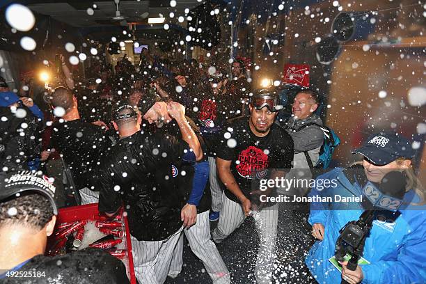 The Chicago Cubs celebrate in the clubhouse after defeating the St. Louis Cardinals in game four of the National League Division Series to win the...