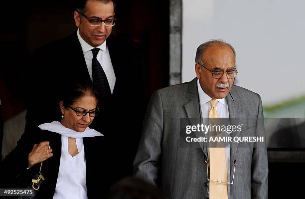 Pakistan's cricket chief Najam Sethi leaves the Supreme Court with his lawyer Asma Jehangir in Islamabad on May 21, 2014. The Pakistani Supreme Court...