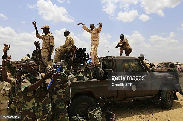 Sudanese Armed Forces and troops from Rapid Support Forces celebrate after recapturing the Daldako area, about 20 kilometres northeast of South...