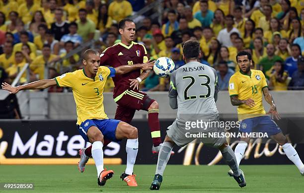 Brazil's Miranda and Venezuela's Ronald Vargas vie for the ball next to Brazil's goalkeeper Alisson during their Russia 2018 FIFA World Cup South...