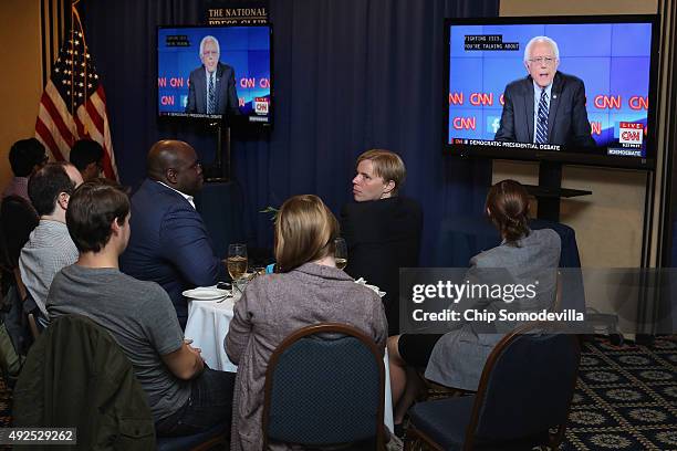 People gather for a watch party during the first televised Democratic presidential candidates debate at the National Press Club October 13, 2015 in...