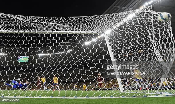 Brazil's Willian scores against Venezuela during their Russia 2018 FIFA World Cup South American Qualifiers football match, at the Estadio Castelao...