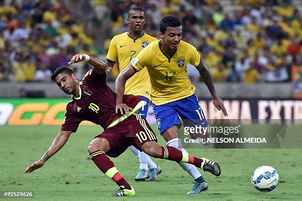 Brazil's Luiz Gustavo vie for the ball with Venezuela's Ronald Vargas during their Russia 2018 FIFA World Cup South American Qualifiers football...