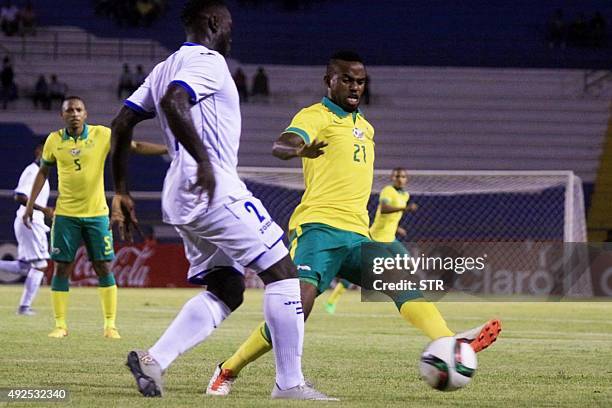 Honduras' Wilmer Crisanto vies for the ball with South Africa's Shongwe Jabulani during a friendly match against Honduras at the Olimpico...