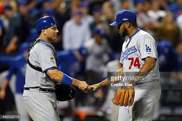 Ellis and Kenley Jansen of the Los Angeles Dodgers of the Los Angeles Dodgers celebrate after defeating the New York Mets in game four of the...