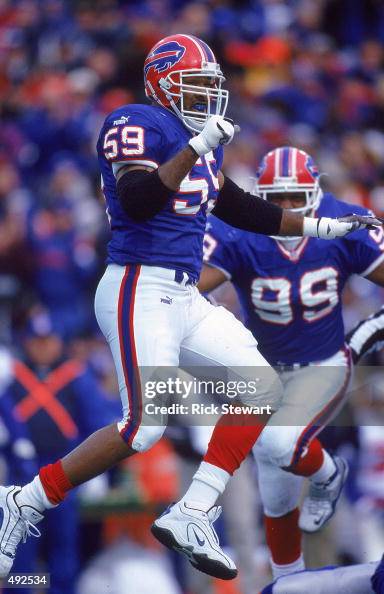Sam Rogers of the Buffalo Bills jumps in celebration during the game ...