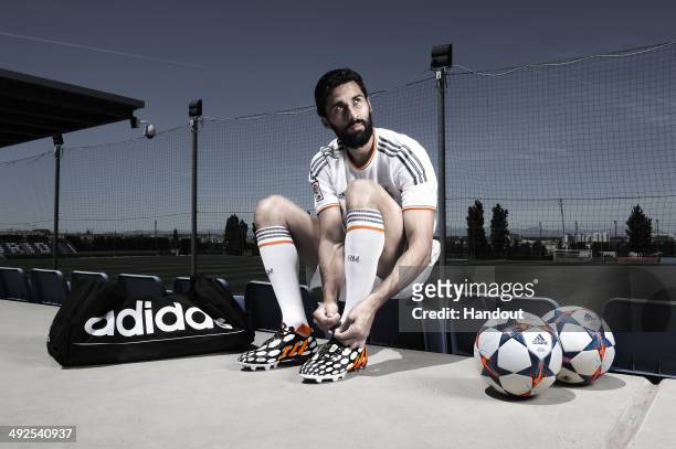 In this image from adidas, Alvaro Arbeloa of Real Madrid tries on his adidas Predator Battle Pack boots ahead of Saturday's UEFA Champions League...