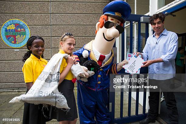 Stephen Mangan visits Sulivan Primary School for a Q & A with Postman Pat at Sulivan Primary school on May 21, 2014 in London, England.