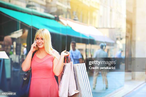 shopping woman talking on the phone - knez mihailova street stock pictures, royalty-free photos & images