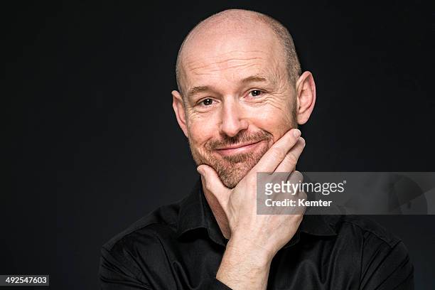 smiling man looking at camera - completely bald bildbanksfoton och bilder