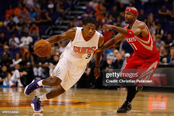 Brandon Knight of the Phoenix Suns drives the ball past Jason Terry of the Houston Rockets during the second half of the preseason NBA game at...