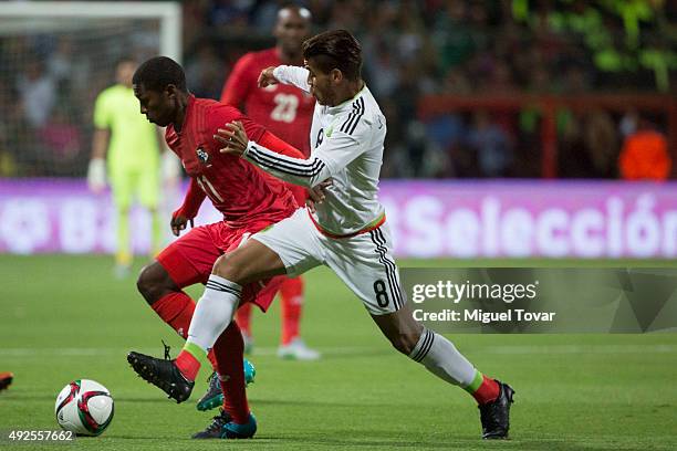 Jonathan Dos Santos of Mexico fights for the ball with Armando Cooper of Panama during the International Friendly match between Mexico and Panama at...