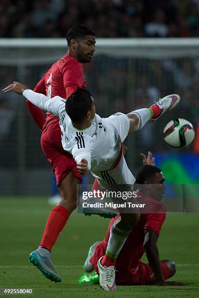 Raul Jimenez of Mexico fights for the ball with Gabriel Gomez of Panama during the International Friendly match between Mexico and Panama at Nemesio...