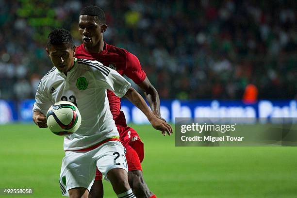 Elias Hernandez of Mexico fights for the ball with Adolfo Machado of Panama during the International Friendly match between Mexico and Panama at...