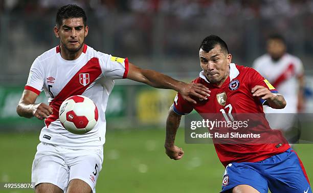 Carlos Zambrano of Peru struggles for the ball with Gary Medel of Chile during a match between Peru and Chile as part of FIFA 2018 World Cup...