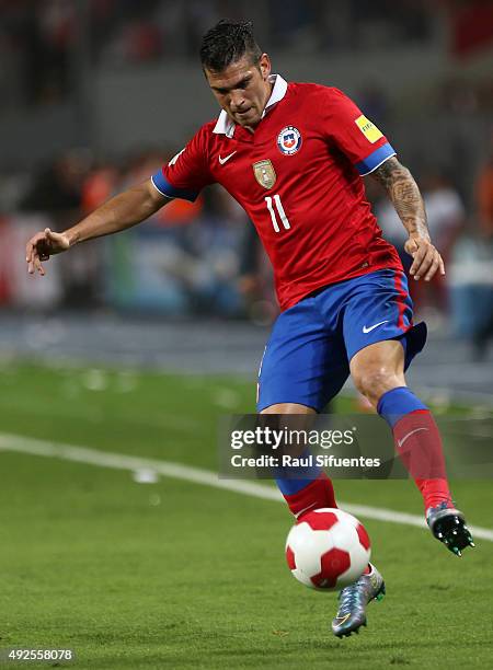 Mark Gonzalez of Chile drives the ball during a match between Peru and Chile as part of FIFA 2018 World Cup Qualifier at Nacional Stadium on October...