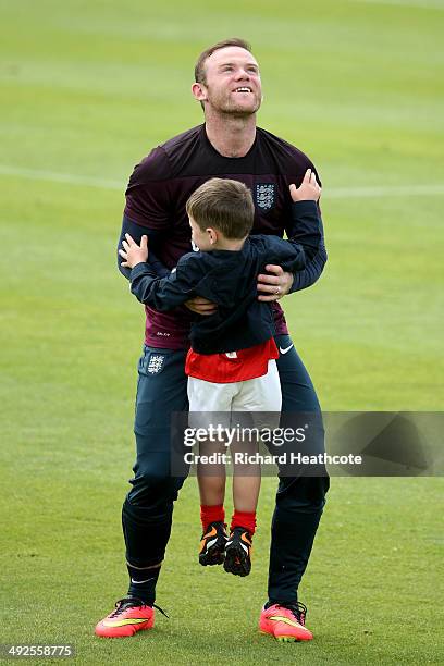 Wayne Rooney hugs his son Kai at the end of a training session at the England pre-World Cup Training Camp at the Vale Do Lobo Resort on May 21, 2014...