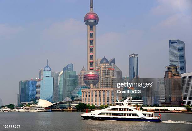 Police ship patrols the Huangpu River during the fourth summit of the Conference on Interaction and Confidence Building Measures in Asia on May 20,...