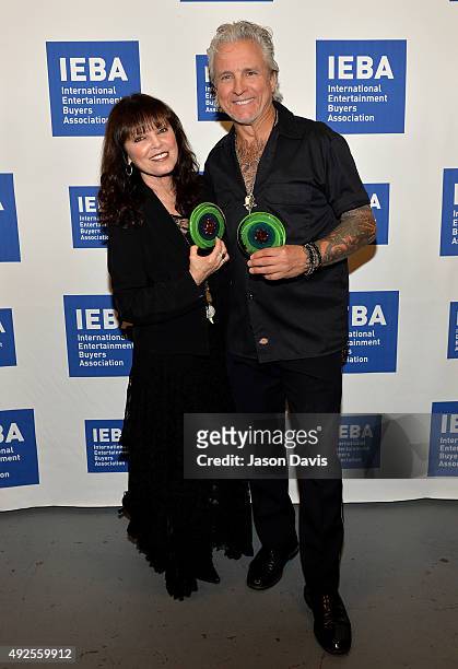 Pat Benatar and Neil Giraldo pose backstage after being inducted into the IEBA Hall of Fame during the IEBA 2015 Conference - Day 3 on October 13,...