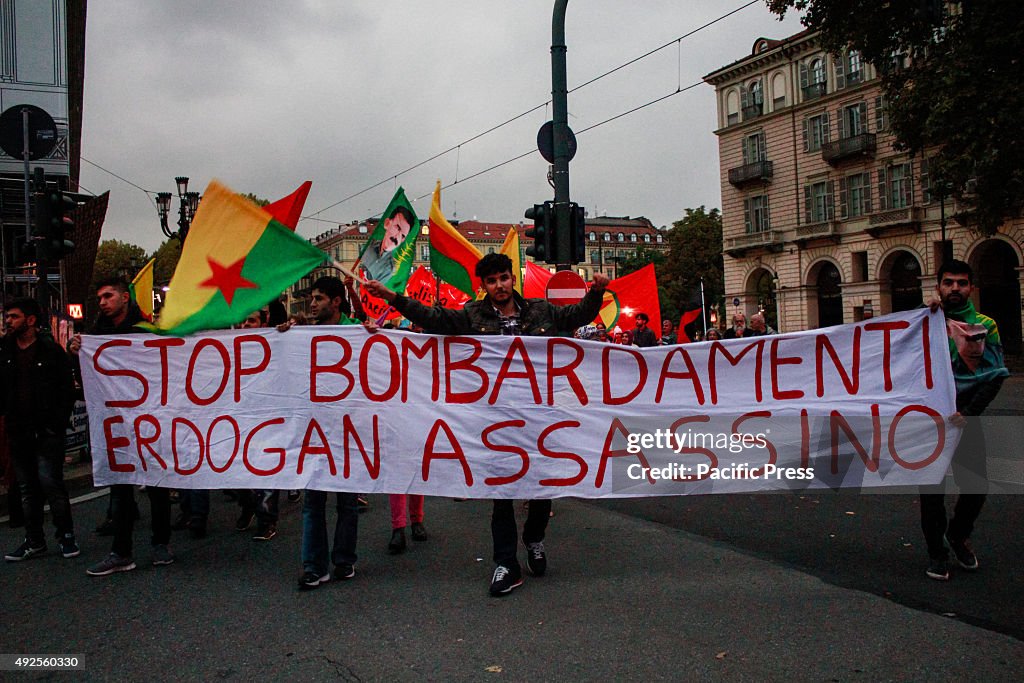 Demonstrators wave flags and bring placards against the...