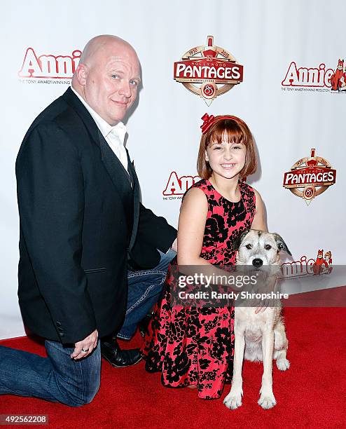 Actor Gilgamesh Taggett, actress Issie Swickle and Macy, the dog playing Sandy, attend the premiere of "Annie" at the Hollywood Pantages Theatre on...