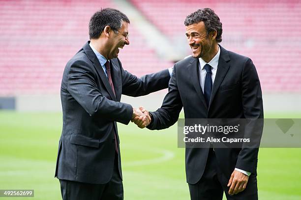 Luis Enrique Martinez shakes hands with President Josep Maria Bartomeu during his official presentation as the new coach of FC Barcelona at Camp Nou...