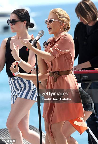 Kylie Minogue performs at Le Grand Journal television show on the Martinez Hotel beach on day 7 of the 67th Annual Cannes Film Festival on May 20,...