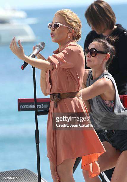 Kylie Minogue performs at Le Grand Journal television show on the Martinez Hotel beach on day 7 of the 67th Annual Cannes Film Festival on May 20,...