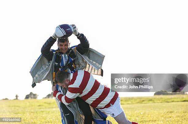 Local rugby player John Lawlor from Daventry RFC tackles stuntman, Gary Conner as he comes down to earth in 'NatWest presents The Flying Winger', a...