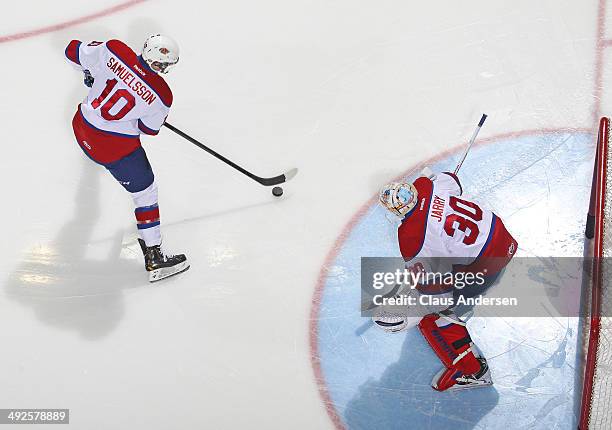 Henrik Samuelsson of the Edmonton Oil Kings takes a shot on teammate Tristan Jarry in the warm-up prior to play against the Val'Dor Foreurs in Game...