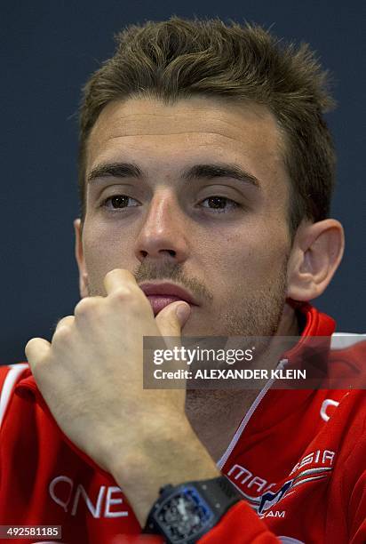 Marussia's French driver Jules Bianchi sits during a press conference at the Circuit de Monaco in Monte Carlo on May 21, 2014 ahead of the Monaco...