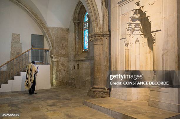 Jewish man recites the Psalm of David inside to the Cenacle or Upper Room on Mount Zion just outside the Old City of Jerusalem, on May 21, 2014. For...